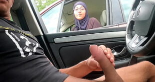 Muslim woman on motorway service area.. She stops to call her husband